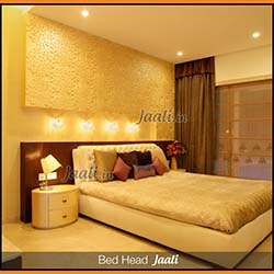 Elegant master bedroom bed head MDF Jaali used as a texture